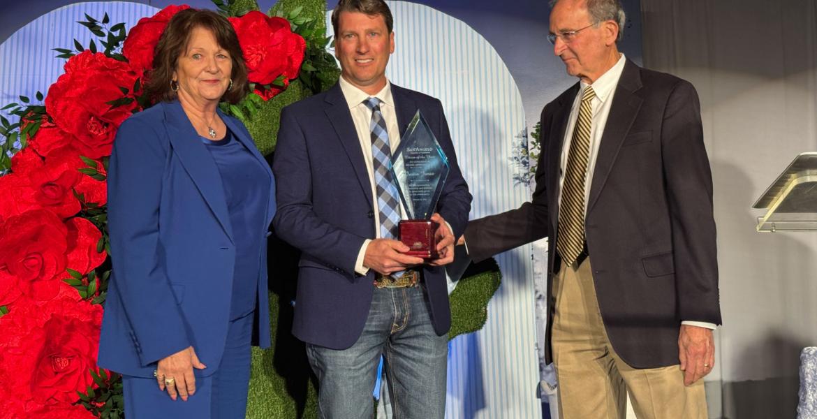 Justin Jonas (center) flanked by Jean Ann LeGrand and Bob LeGrand