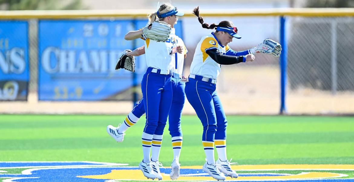Kamren Loeffler, Karli Manney and Tatiana Trotter celebrate during the Angelo State softball team's home-opening tournament during the 2026 season.