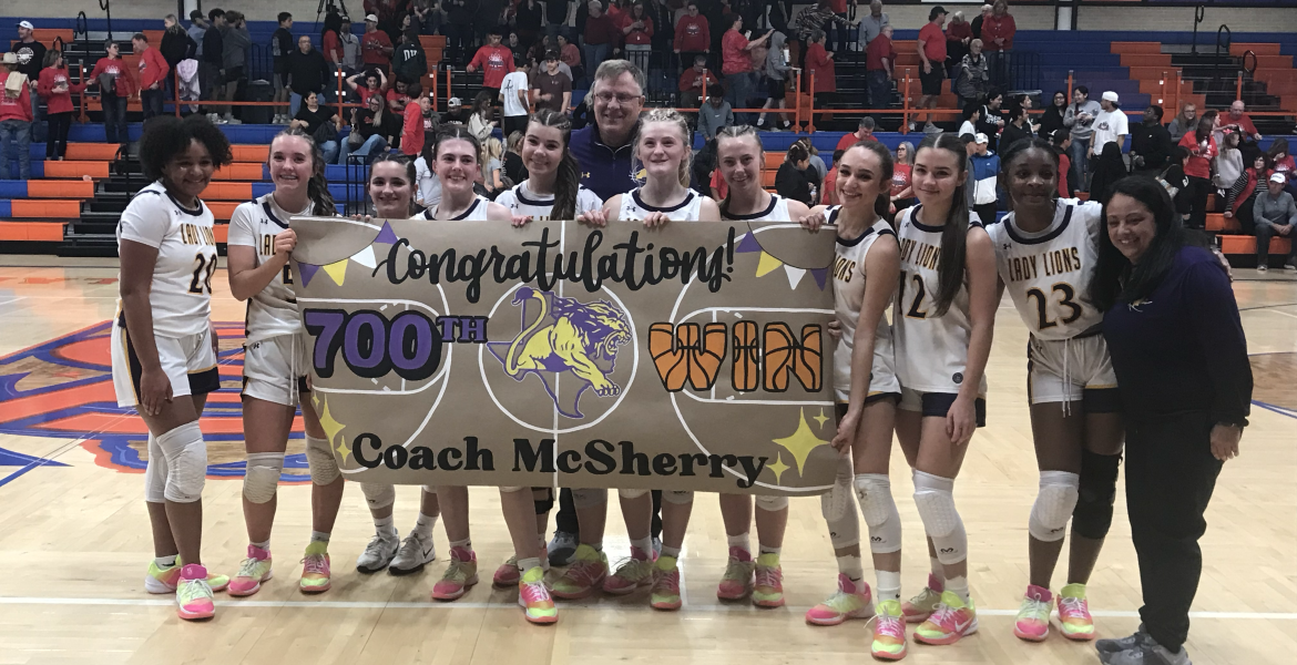 The Ozona girls basketball team celebrates after their bidistrict playoff win over Ballinger, which was the 700th career victory for head coach Jerry McSherry.