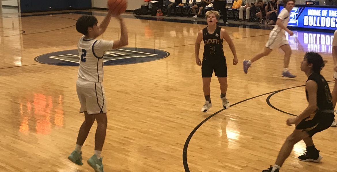 Eden's Avery Condarco knocks down one of his five 3-pointers in the Bulldogs' 50-24 win over Menard on Tuesday, Feb. 3, 2026.
