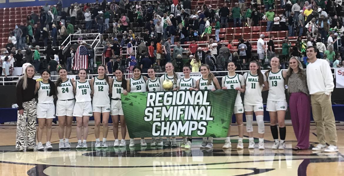 The Wall Lady Hawks celebrate after their 35-25 win over Idalou on Tuesday in the regional semifinals in Snyder.