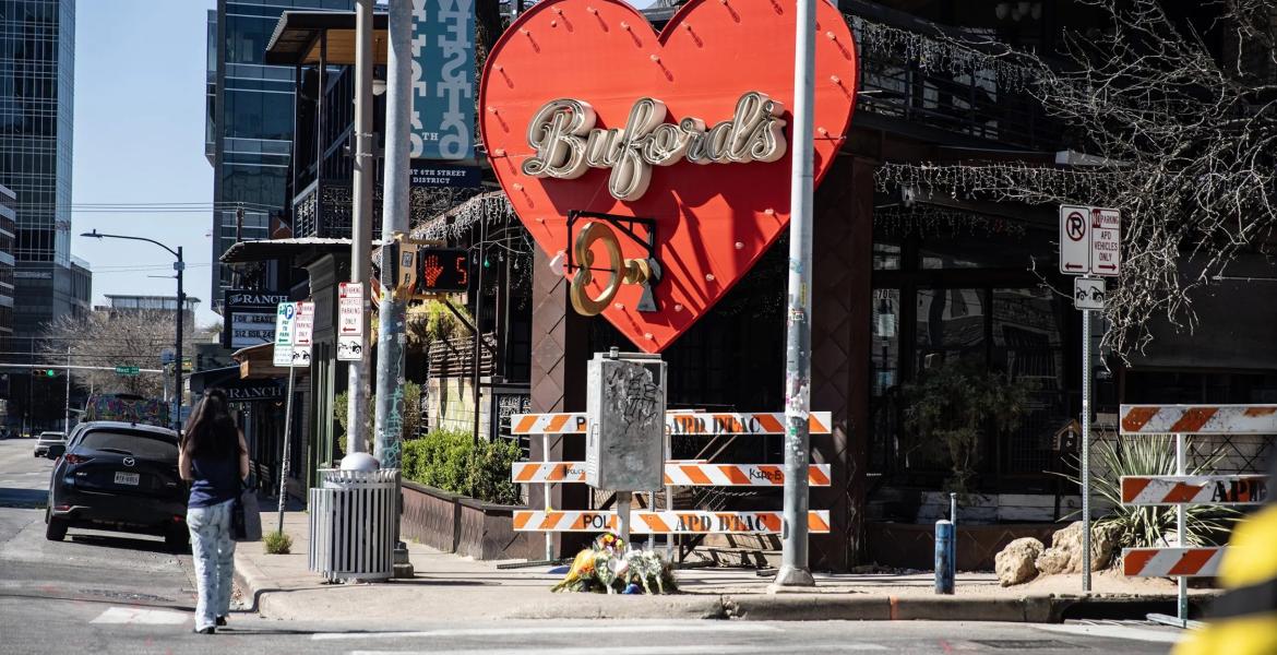 Flowers are left in front of Buford's on West 6th Street in downtown Austin on March 2, 2026. A third victim of a Sunday shooting died Monday, raising the toll to four, including the suspected gunman.