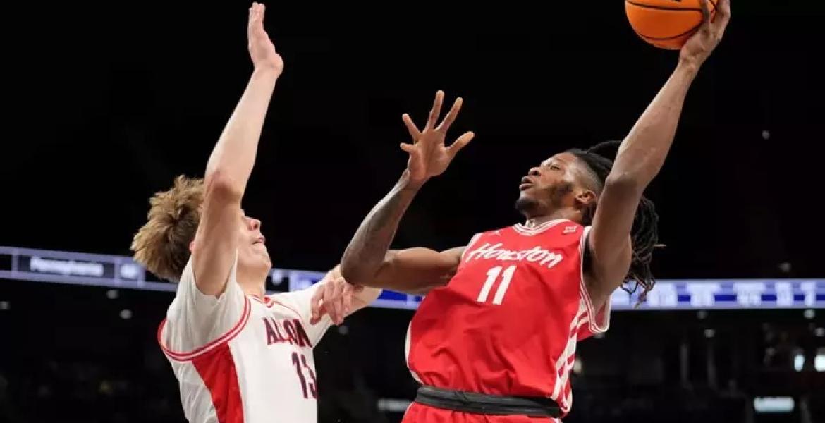 Houston's Joseph Tugler shoots over an Arizona defender during the SEC Tournament Final on March 14, 2026.