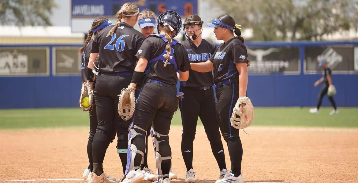 The Angelo State softball team meets at the pitcher's circle during the 2026 season.