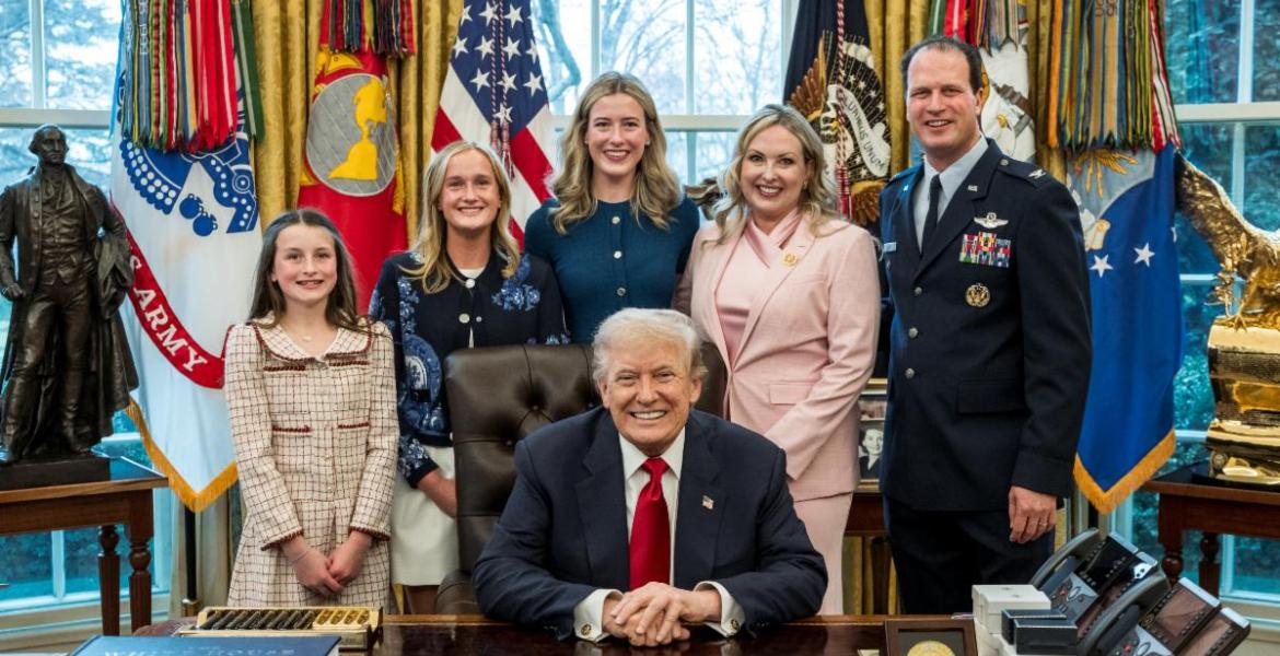 August Pfluger poses with his family and President Donald Trump on March 6, 2026, after his retirement from the U.S. Air Force.