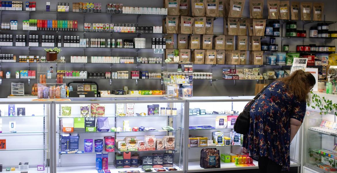 A customer browses products at Austin Vape &amp; Smoke in Austin.