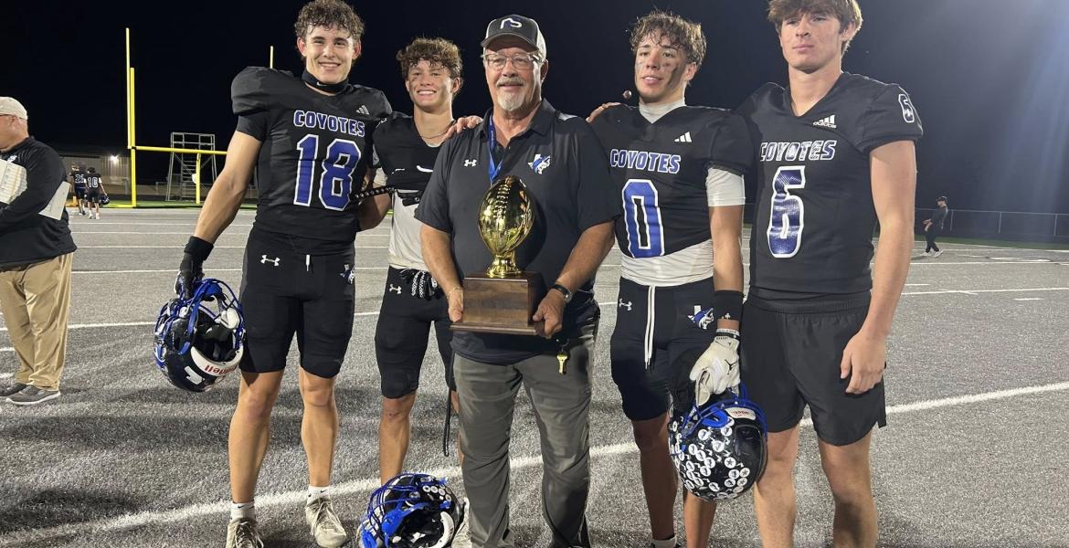 Head coach Harley Ethridge celebrates with Richland Springs after a playoff win during the 2025 football season.