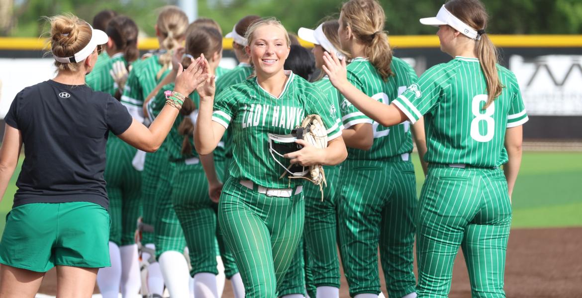 The Wall Lady Hawks prepare to take the field during the 2026 softball season.