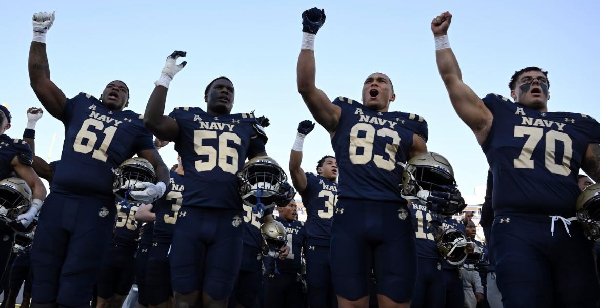 The Navy football team celebrates a win during the 2025 season.