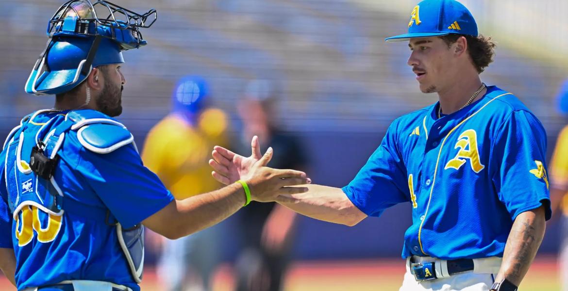 Angelo State's Chris Bernal (left) and Isaac Godard celebrate after a 12-2 win over Texas A&amp;M-Kingsville in the opening round of the LSC Tournament on Monday, May 4, 2026.