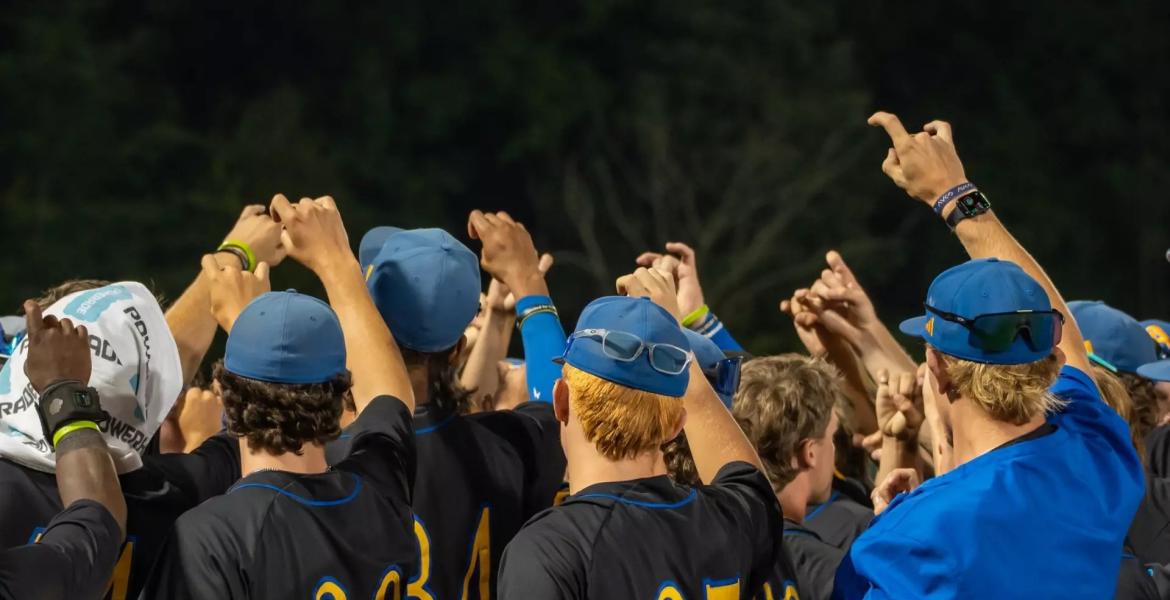 The Angelo State baseball team huddles during the 2026 season.
