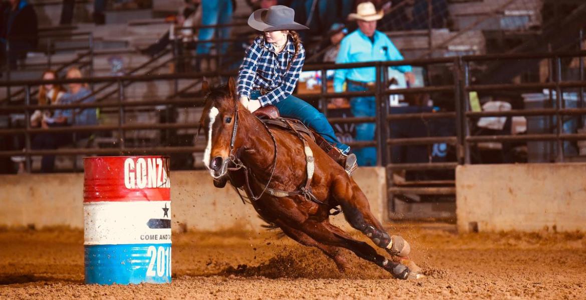 A barrel racer competes in the Texas High School Rodeo Association State Finals in 2025.