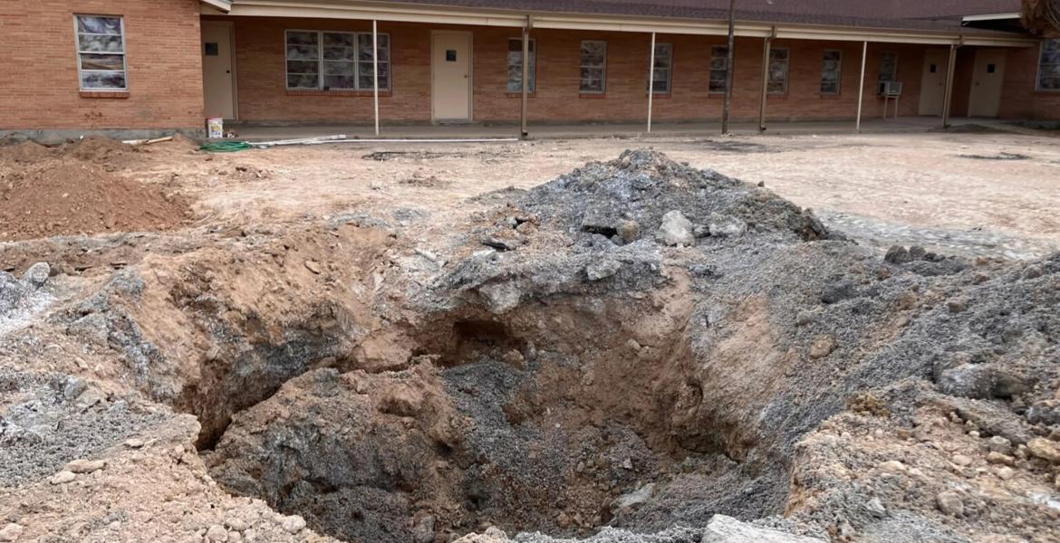 A pit in the parking lot of the First Baptist Church in Grandfalls, where the Railroad Commission plugged a wellbore that had gushed thousands of gallons of wastewater. Grandfalls is southwest of Odessa, between Monahans and Fort Stockton.