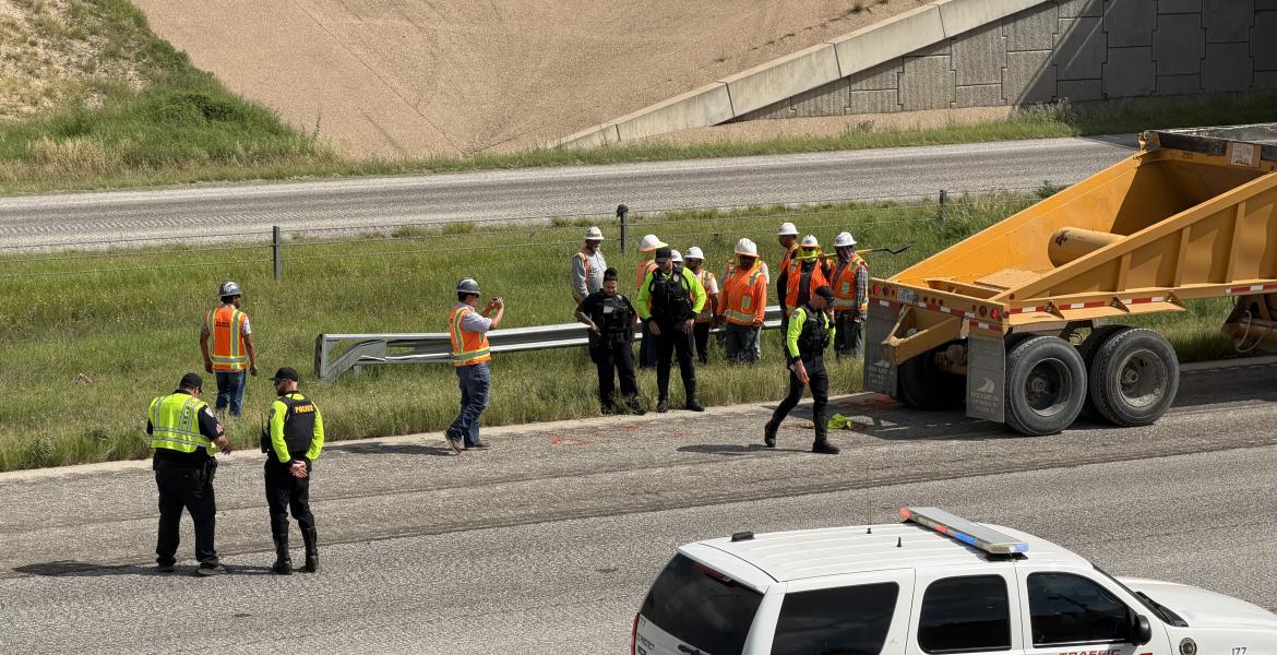 A road worker had his leg broken when he was backed over by a construction vehicle Tuesday morning on the Houston Harte Expressway.