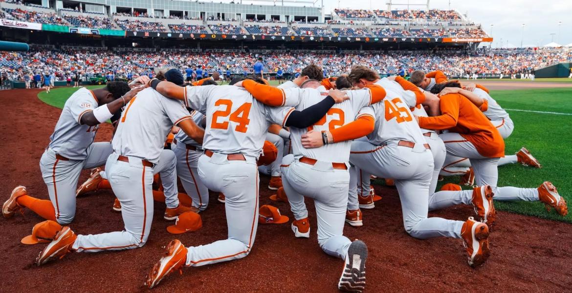 The Texas Longhorns huddle at the 2026 College World Series