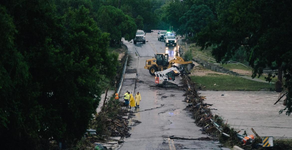 First responders on a bridge covered by water after the flood in Kerrville on July 16, 2026.