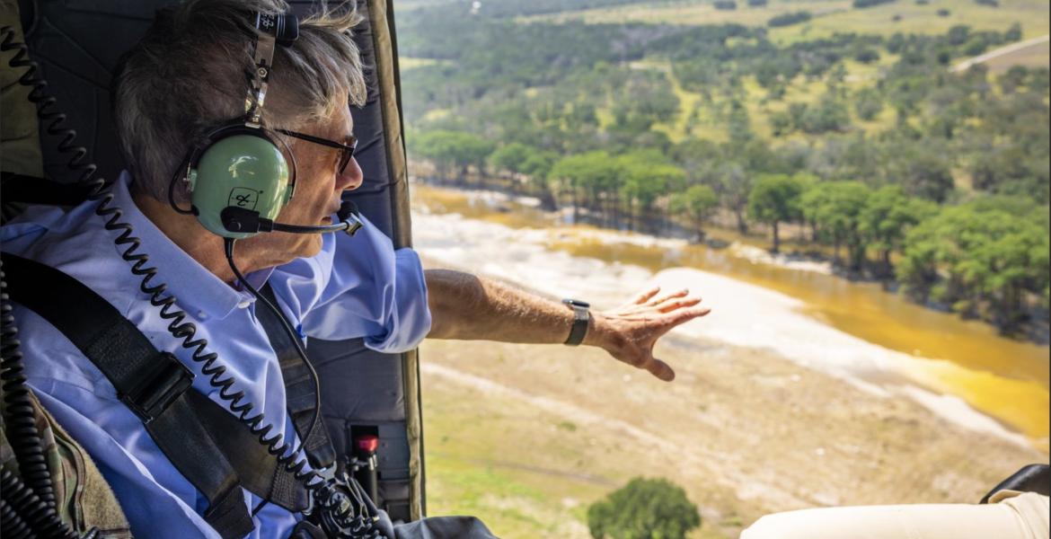 Gov. Greg Abbott surveys flooding during July, 2026.