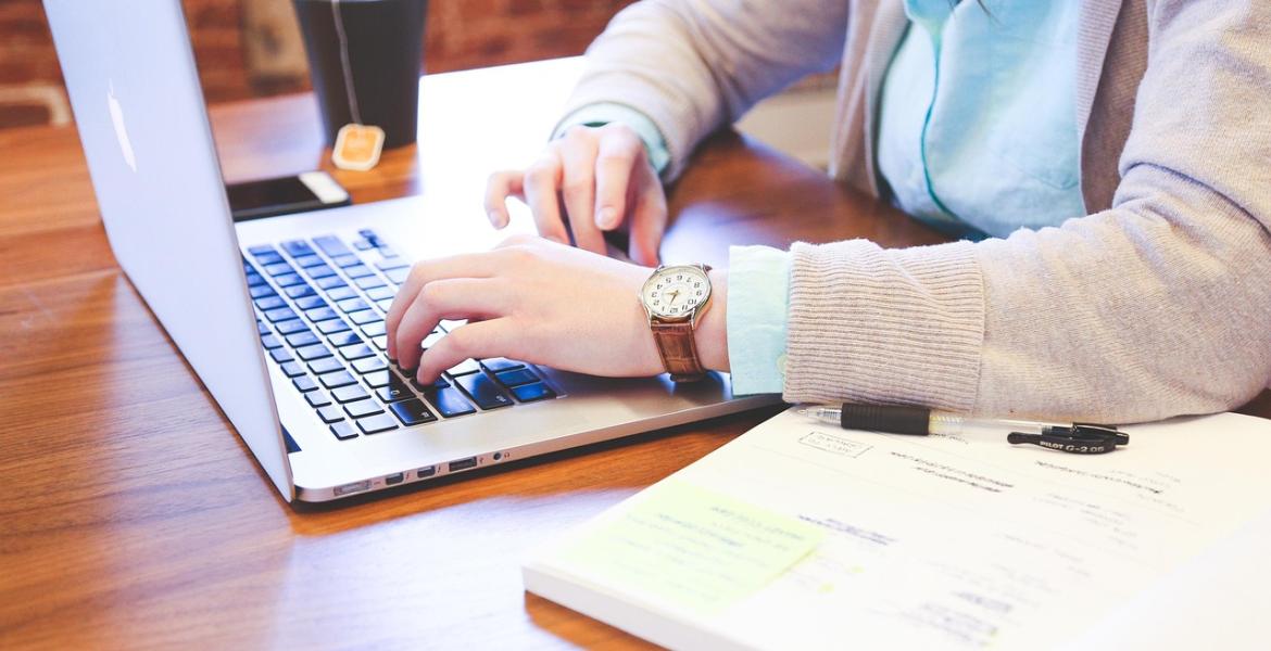 A woman working on her laptop computer.