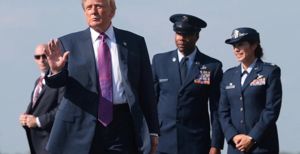 U.S. President Donald Trump waves to supporters after disembarking Air Force One at Ellington Field Joint Reserve Base in Houston on Aug. 27, 2026.