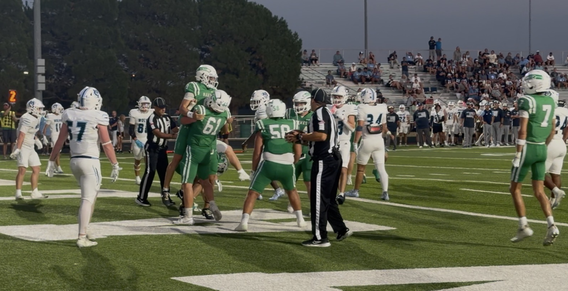 Wall Offensive Lineman Tate Probandt celebrates with Gunner King after he scored a rushing touchdown against Canyon West Plains