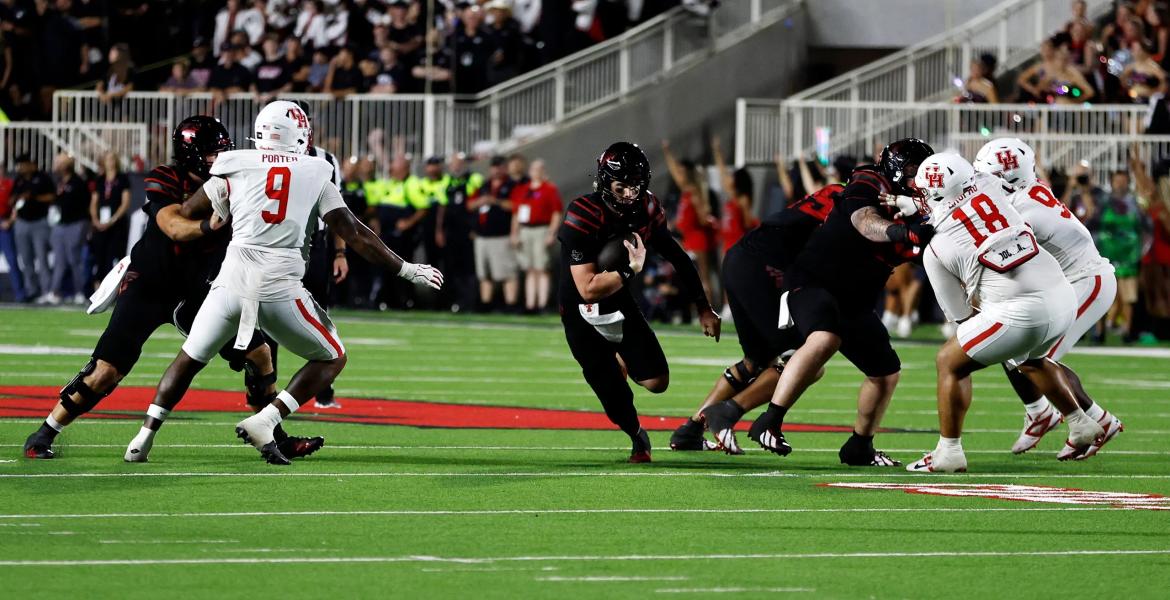 Texas Tech Red Raiders quarterback Will Hammond (15) rushes against the Houston Cougars in the second half at Galaxy Stadium in Lubbock on Sept. 18, 2026.