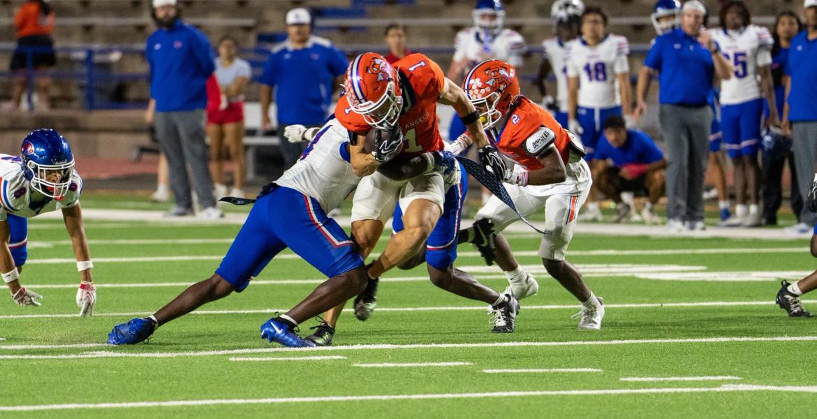 San Angelo Central's Gavin Johnson makes a catch in traffic against Abilene Cooper on Friday, Sept. 11, 2026.