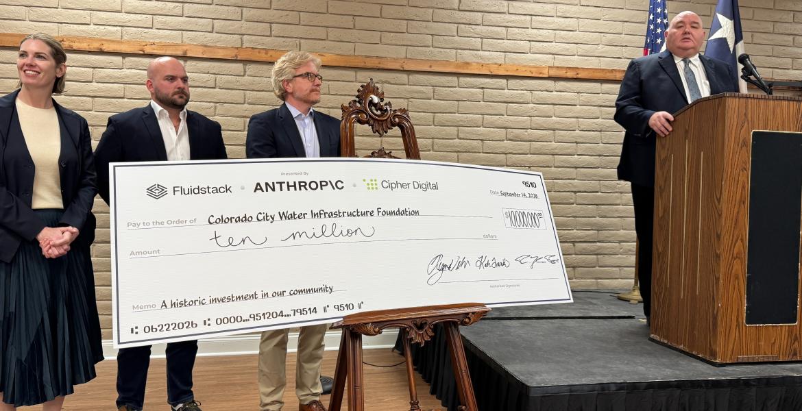Colorado City Mayor Ruben Hurt is at the podium. To his right, from left to right, are Fluidstack's Kate Fraco, Anthropic's Ryan Wilson, and Cipher Digital CEO Tyler Page. (LIVE! Photo/Joe Hyde)