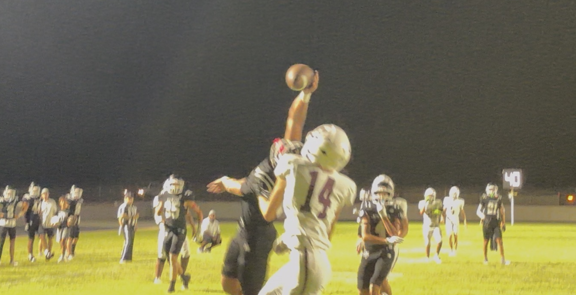 Branson Lacy bats down a 4th down pass intended for Rankin's Brinden Norwood