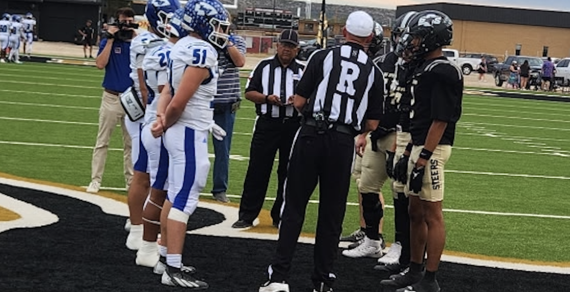 Lake View and Big Spring meet for the coin toss before their game Friday, Sept. 25, 2026.