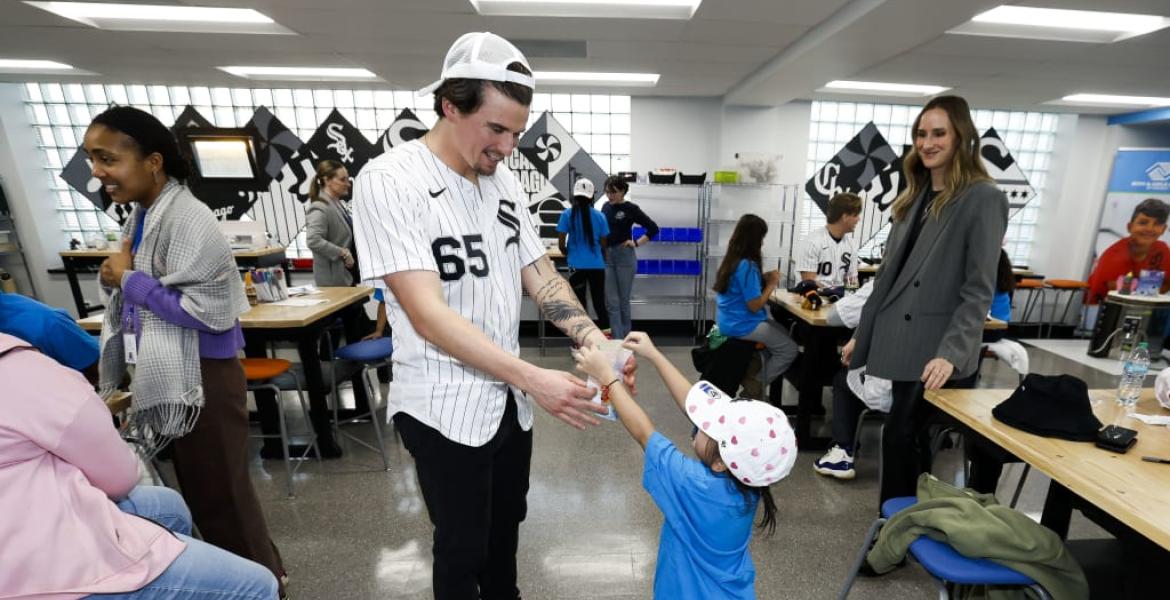 Chicago White Sox pitcher Davis Martin interacts with a young fan during the 2026 season.