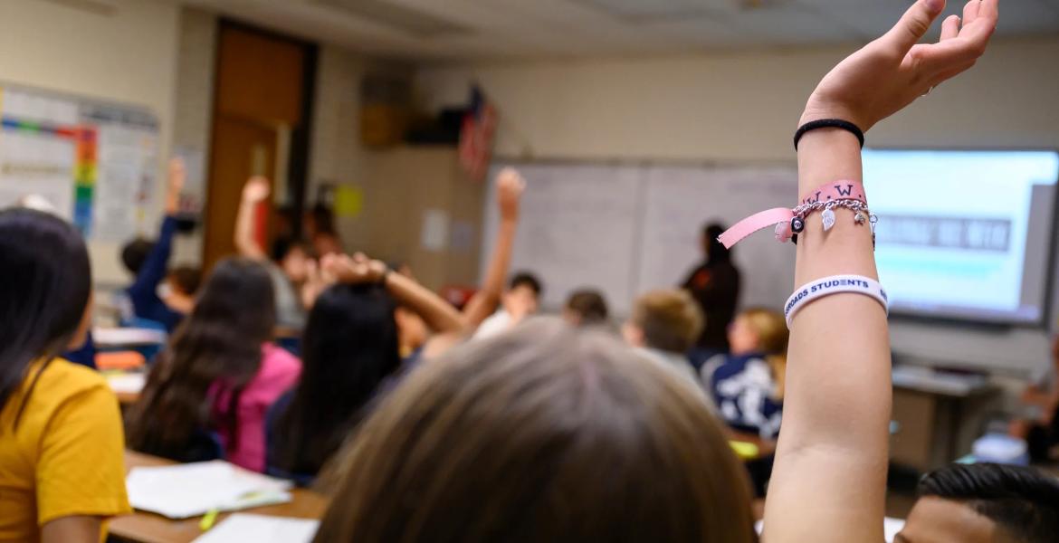 A Nimitz Middle School student raises her hand during class on Sept. 13, 2023 in Odessa.