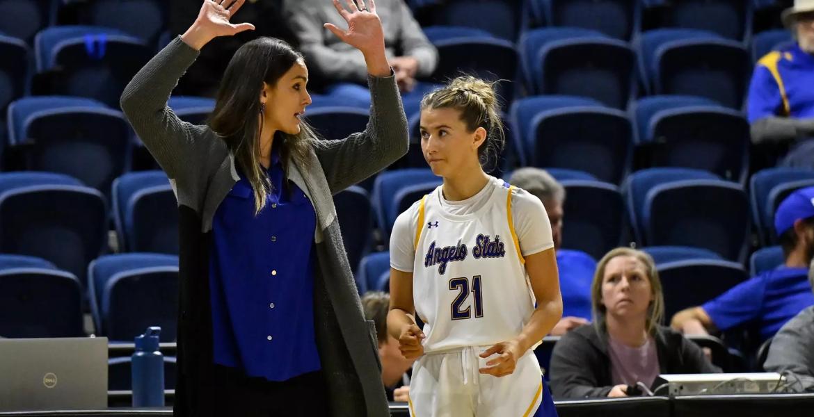 Angelo State women's basketball coach Alesha Ellis talks to Majik Esquivel during the 2025-26 season.